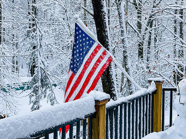 istock America Flag on Snow-Covered Porch in Winter Forest Setting 2218043385