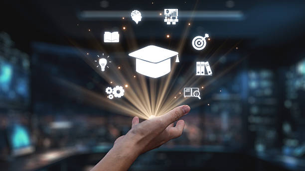 istock Hand Reaching for Graduation Cap with Floating Education Icons Representing Knowledge, Learning, Innovation, and Future Opportunities in Modern Workspace. Auvana 2218043544