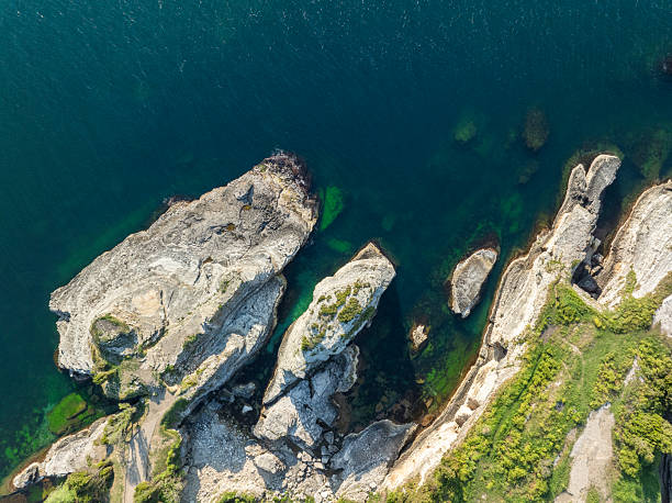 istock Aerial view directly above rugged coastal cliff 2218044493