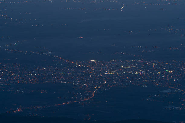 View of city lights at sunset