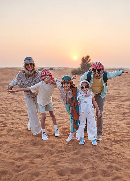 Beautiful family in Dubai desert stock photo
