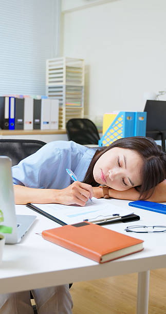 istock asian businesswoman lying flat desk 2218053896