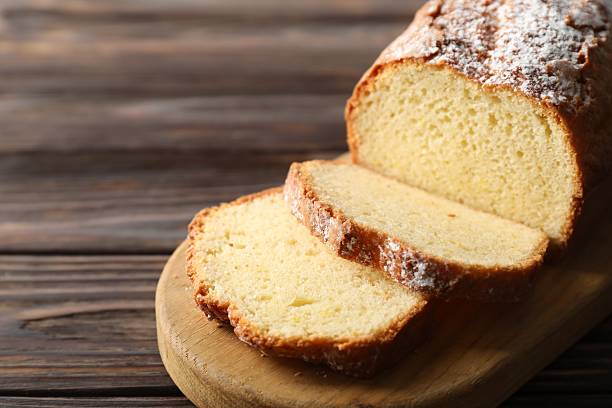 istock Freshly baked sponge cake on wooden table, closeup 2218053929