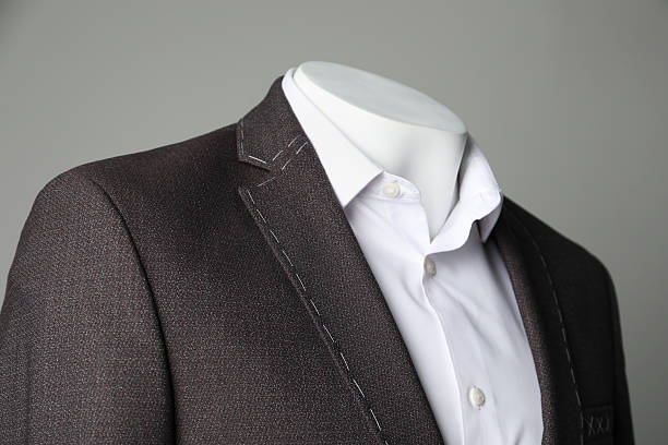 istock Semi-ready jacket and white shirt on mannequin against grey background, closeup 2218054717