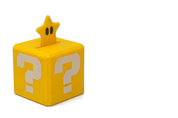 a little yellow box with a big white question mark printed on each face. It recalls a graphic element of a famous platform, isolated on white background