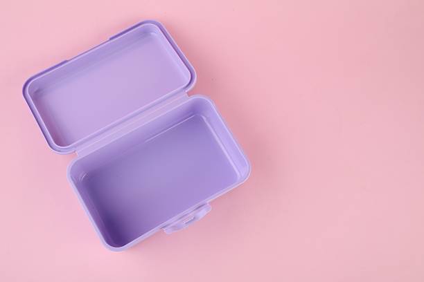 istock Plastic lunch box on light pink background, top view. Space for text 2218056312