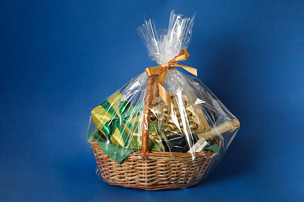 istock Wicker gift basket with wine on blue background 2218056644