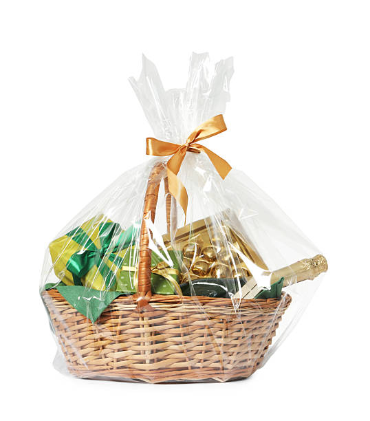 istock Wicker gift basket with sparkling wine isolated on white 2218056660