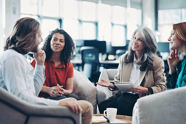 istock Middle aged businesswoman talking to her team 2218057392