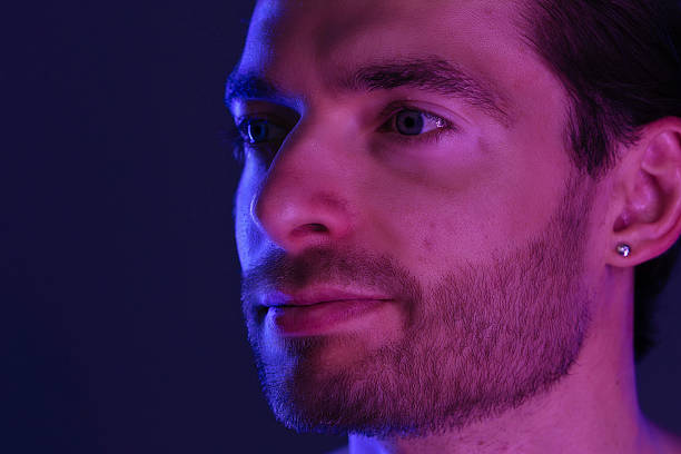 istock Portrait of a Man with Beard under Neon Lights 2218059401