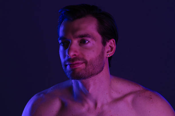 istock Portrait of a Man with Beard under Neon Lights 2218059442