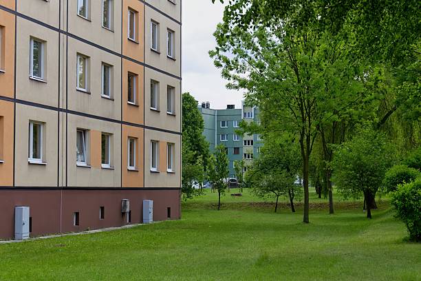 istock A building sits beside a green lawn and trees. 2218060839