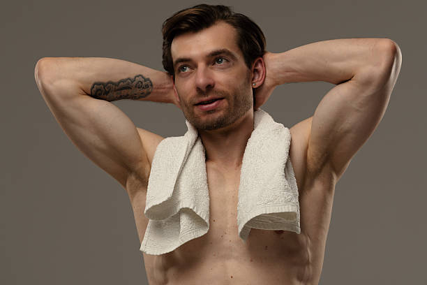 istock Muscular Man Posing on a Beige Background 2218061118