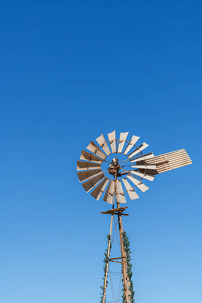 istock Old windmill on a day against blue sky 2218064792