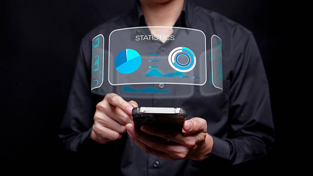 istock A man is using his finger to touch the pop-up charts, statistics and other information 2218067199