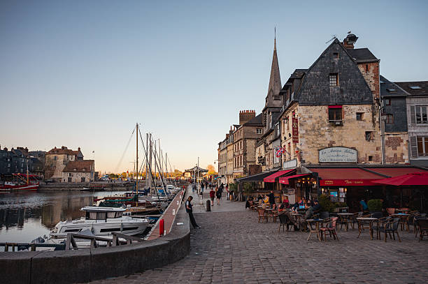 Apartments and sidewalk cafe seen along the harbor in St Martin de Re on the island of Île de Ré, France