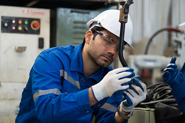 istock Robotic arm, Automatic robotic arm welding. Robotic manufacturing industry. Engineer setup, install, maintain, repair mechanism of operation of robotic arm in workshop 2218069554
