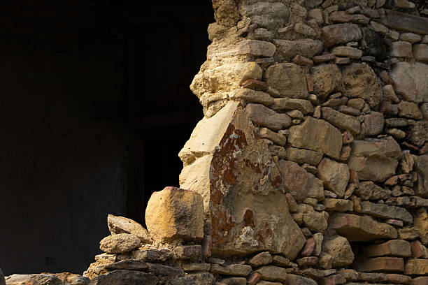 Close up shot of pert stone wall of ruined house