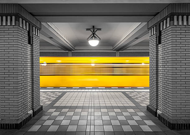 Germany, Berlin, Station Rathaus Reinickendorf, May 17, 2022 - Motion blur of a Berlin subway train entering the station