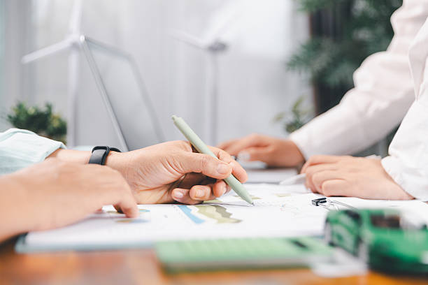 istock Business people working on sustainable innovation project. renewable energy concept. Teamwork Meeting, partner on model building company office technology, based green businesses and global warming. 2218076989