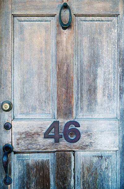 istock Old weathered wooden door. Close up view 2218079612