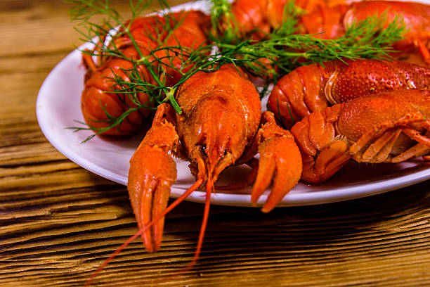 crayfish and lemons on a wooden table