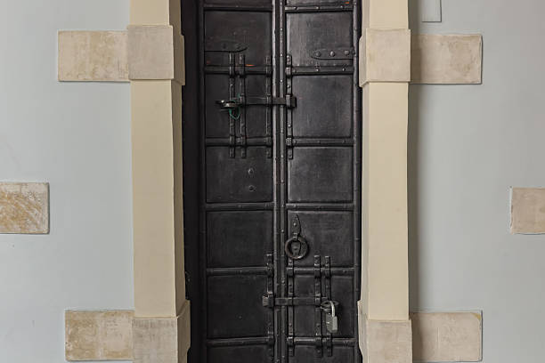 istock Black antique wrought iron door with a lock. 2218084221