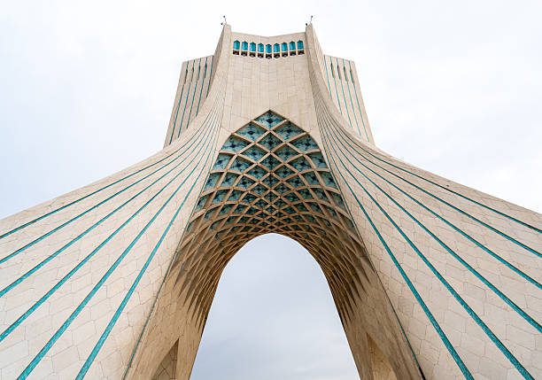 Tehran, Iran - November 12, 2023: Upward view of Azadi Tower details and geometric stone design