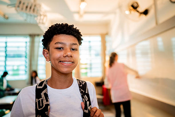 Portrait of a schoolboy at classroom