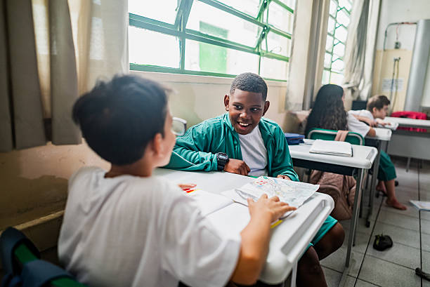 istock Child boy talking with friend on the classroom 2218093102