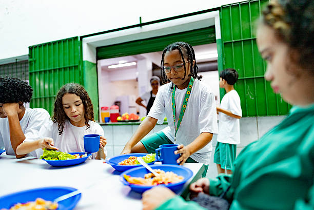 istock School children having lunch in the cafeteria at school 2218098630