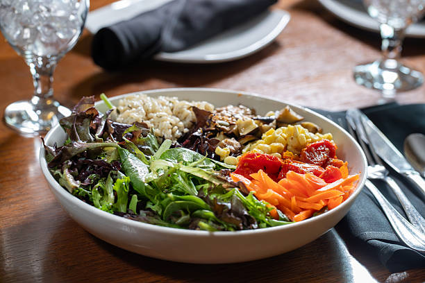 istock Vegan bowl with grains, carrots, spring mix, beans and corn 2218099066