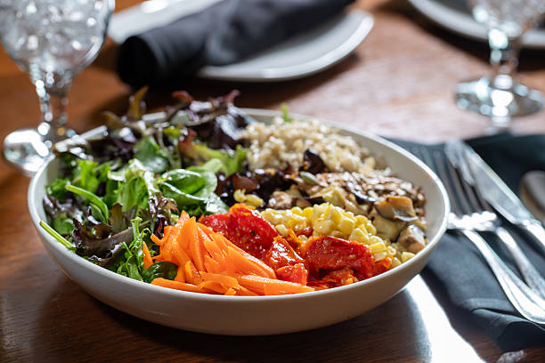 istock Vegan bowl with grains, carrots, spring mix, beans and corn 2218099068