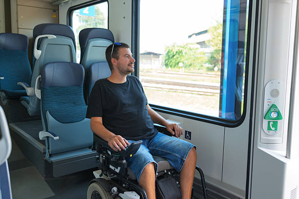 istock Man with disability enjoying a train journey 2218100894