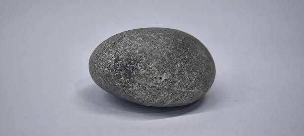 istock Natural river stones on white background 2218104739