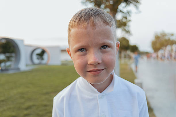 Portrait of a 6 year old boy looking up