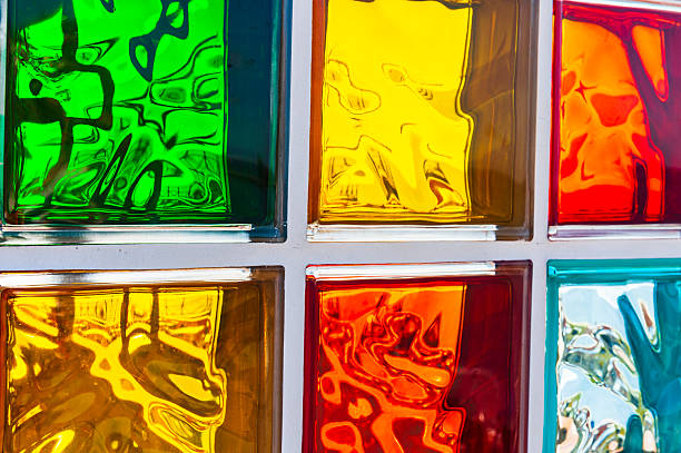 Colorful glass Madeira blocks reflecting light in vibrant patterns on a sunny day