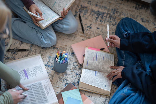 istock Group Studying and Highlighting Bible Passages for a Spiritual Discussion 2218106774