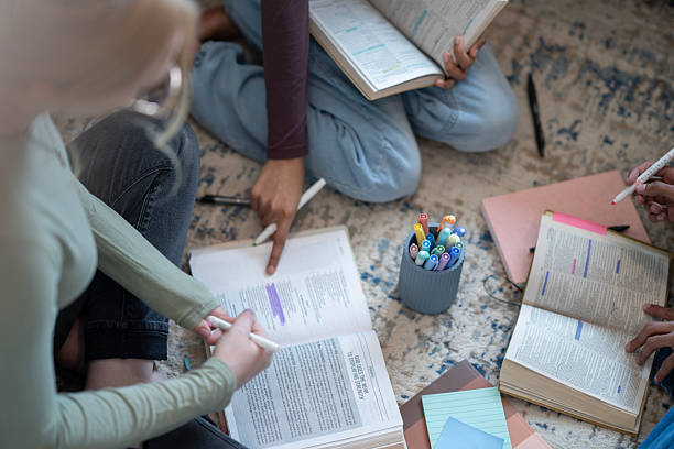 istock Group of Friends Collaborating in a Cozy Bible Study Session 2218107081