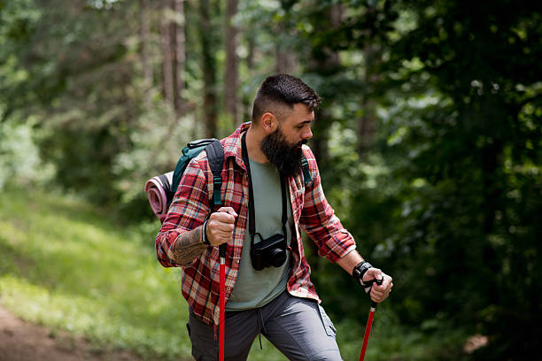 istock Solo Hiker Navigates Forest Slope 2218107196