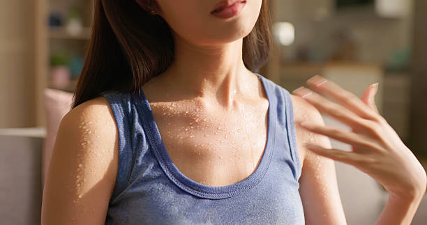 istock woman sweating summer discomfort 2218107218