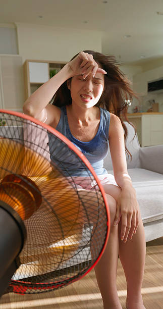 istock woman hot summer discomfort 2218107292