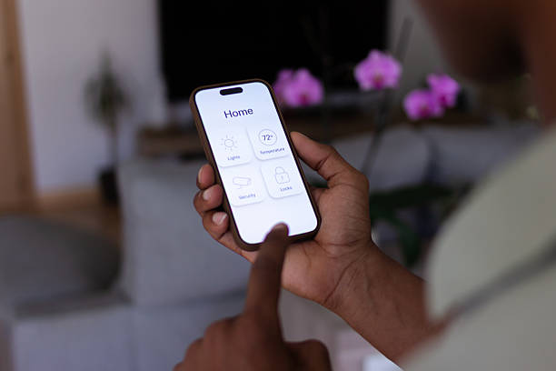 istock Homeowner controlling home appliances with mobile application 2218108458