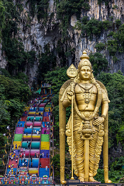 kuala lumpur, malysia- september 18, 2024: golden statue at batu cave in kuala lumpur, malaysia.