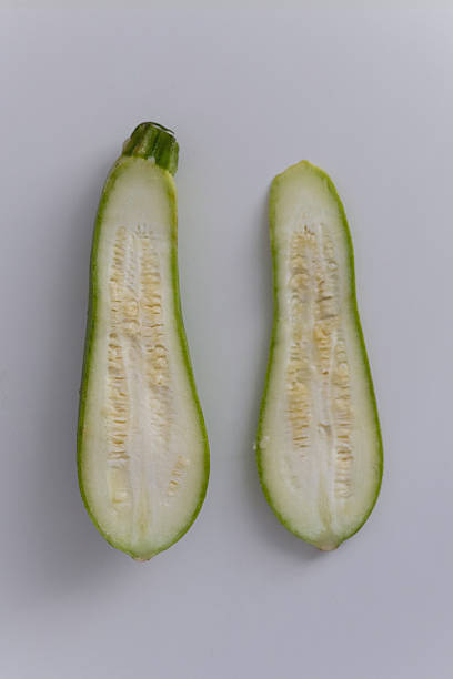 istock Halved Zucchini on White Background 2218113825