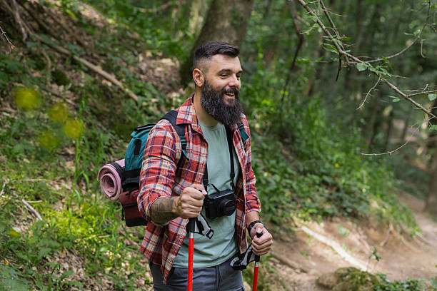 istock Happy Adventurer Walks and Scans Forest Path 2218118325