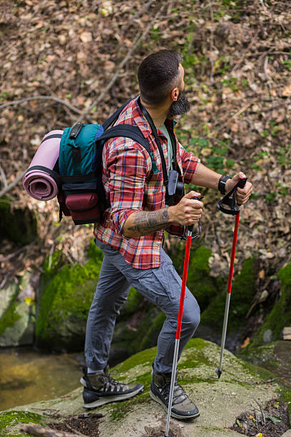 istock Hiker Stands on Rock in Stream, Back to Camera 2218118420