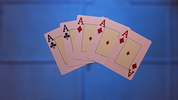 istock Playing Cards Featuring Aces Below the Glass Table 2218124301