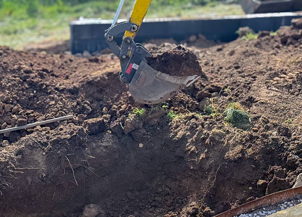 istock Close up view of excavator bucket digging ground on construction site 2218125007