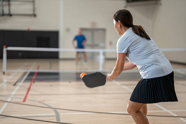 istock Woman Playing Pickleball Indoors Featuring Dynamic Action and Focus 2218126752